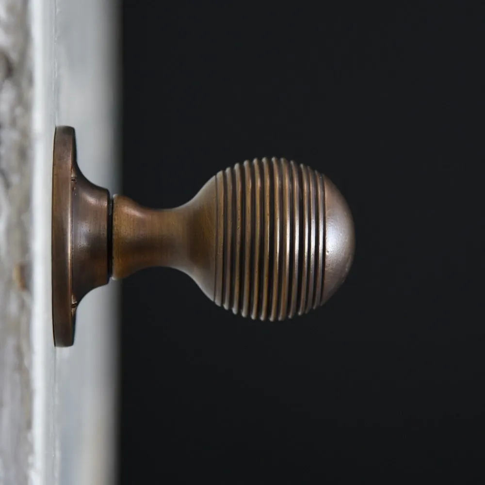 Distressed Antique Brass Reeded Beehive Door Knobs